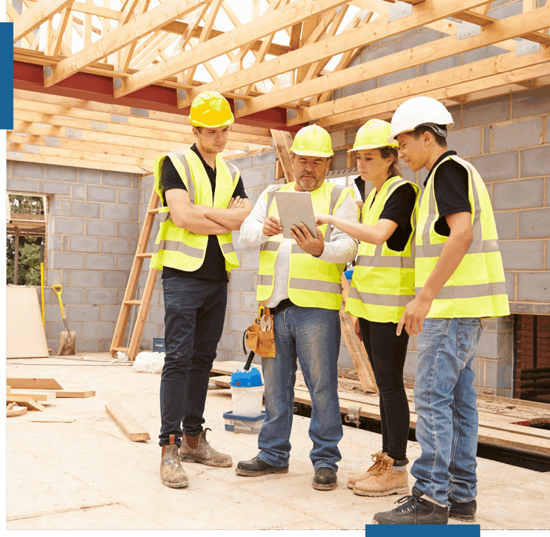 Construction team reviewing plans on site